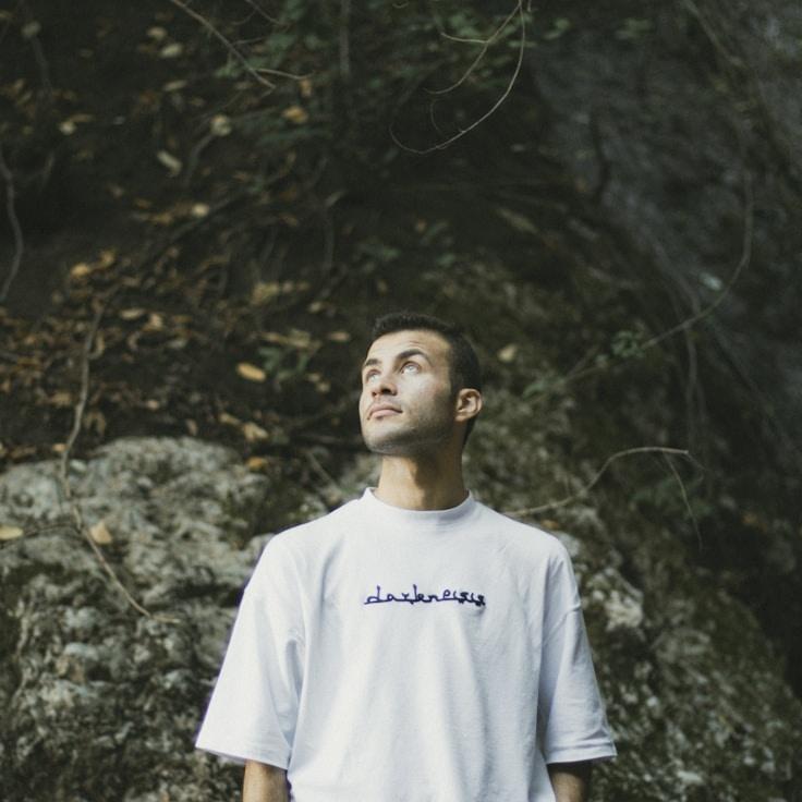 Kaveri Mehta, Lead Design Curator at Basil Corner Lumen, reviewing corporate floral arrangements